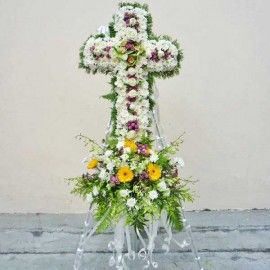 Yellow Gerbera and White Pompom in cross metal stand.