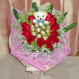 11 Red Roses with 9 Ferrero Roche and Bear Hand Bouquet 