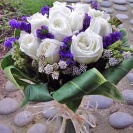 12 White Roses With Cordyline Foliage Hand Bouquet.
