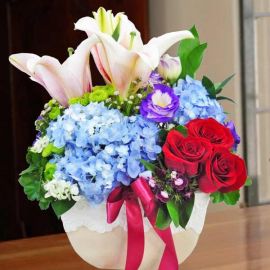 Blue Hydrangeas, Lilies & Red Roses in Vase Arrangement